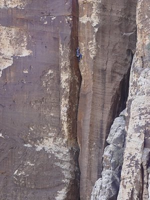 Pat Dezonia on the mighty offwidth of Da Bonyard (5.10b), East Face of Rainbow Mountain.